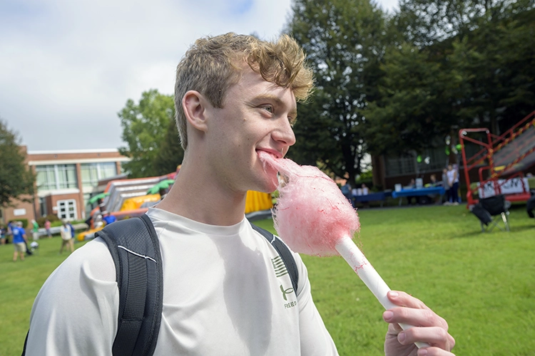 student eating cotton candy
